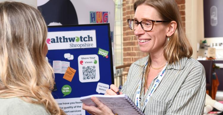 Healthwatch lady taking comment from public