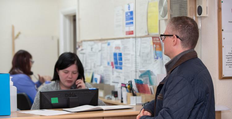 Man waiting at GP reception