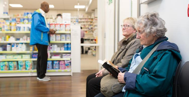Women sitting in a pharmacy