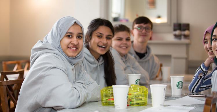 Group of young volunteers smiling at the camera