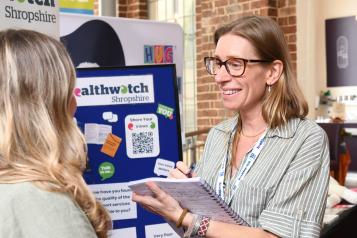 Healthwatch lady taking comment from public