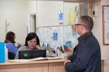 Man waiting at GP reception