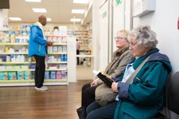 Women sitting in a pharmacy