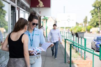 Two people looking at survey