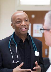 Male doctor speaking to a male patient